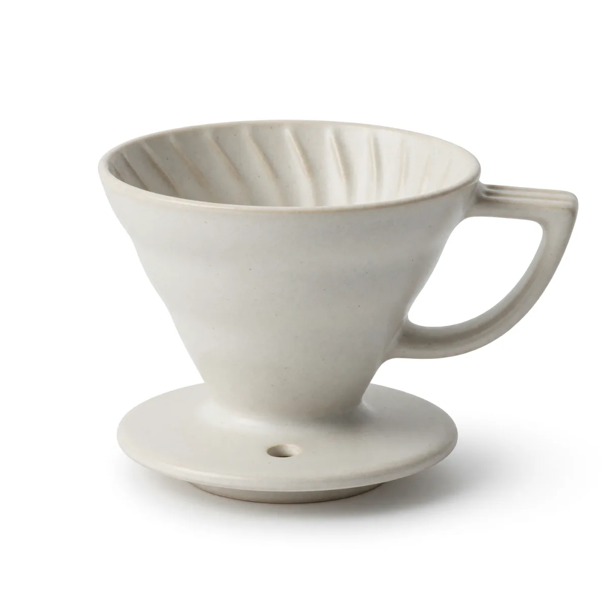 Grok Imagine Quality text-to-image: a cream ceramic pour-over dripper with spiral inner ribs, a side handle and a round base with a drain hole