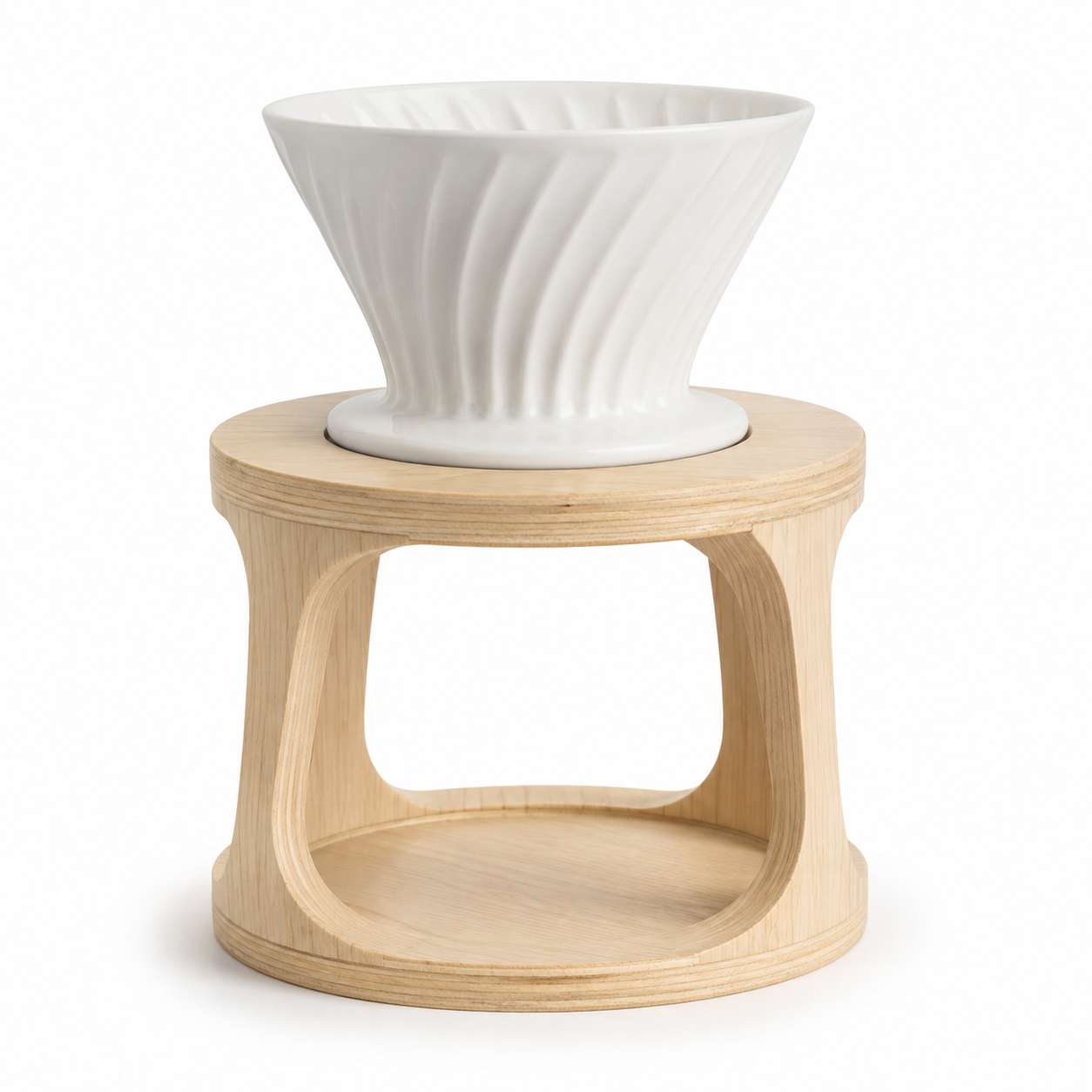White ceramic pour-over coffee dripper on a plain white studio background