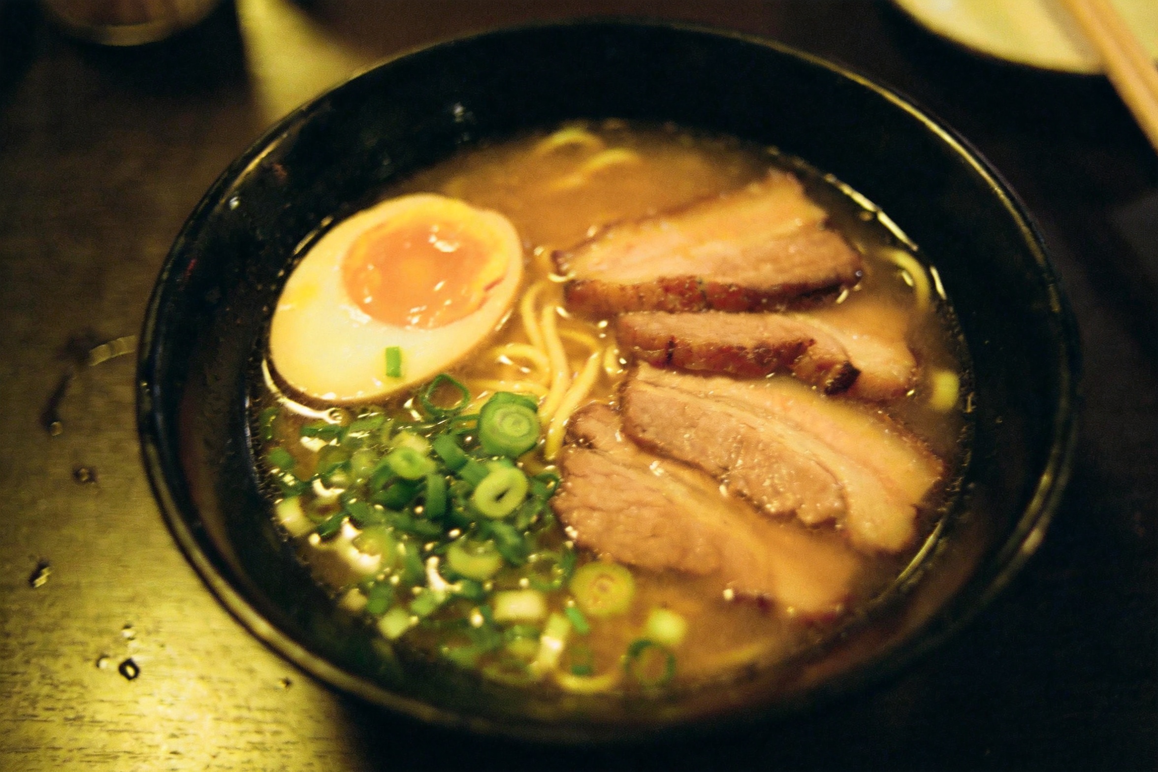Source: underexposed phone photo of ramen with a yellow color cast