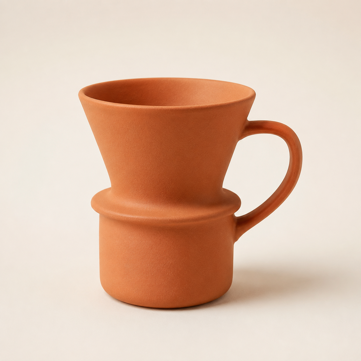 Reference: terracotta pour-over mug on studio background
