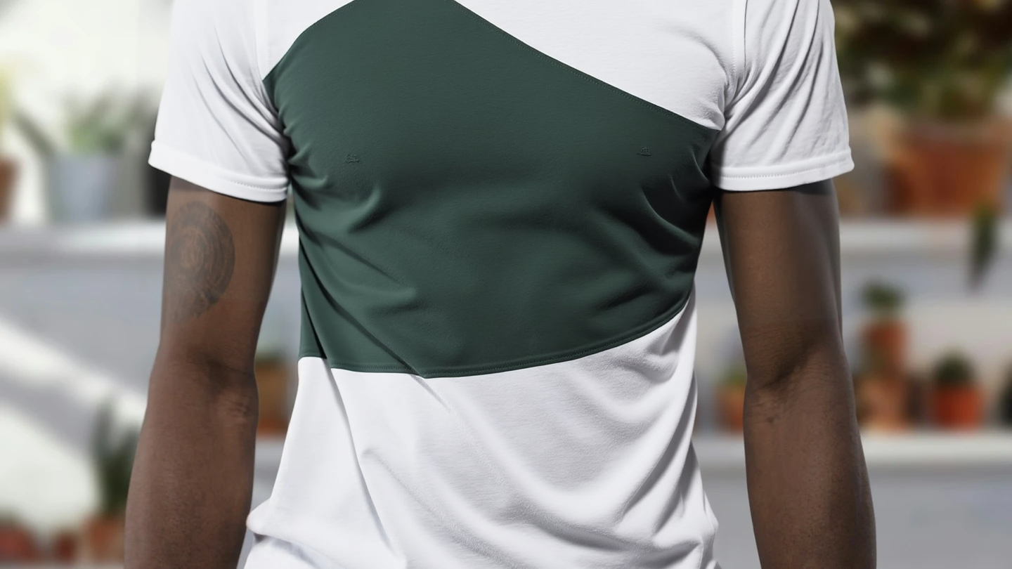 Output: the torso is now a deep forest green block while sleeves and hem stay white
